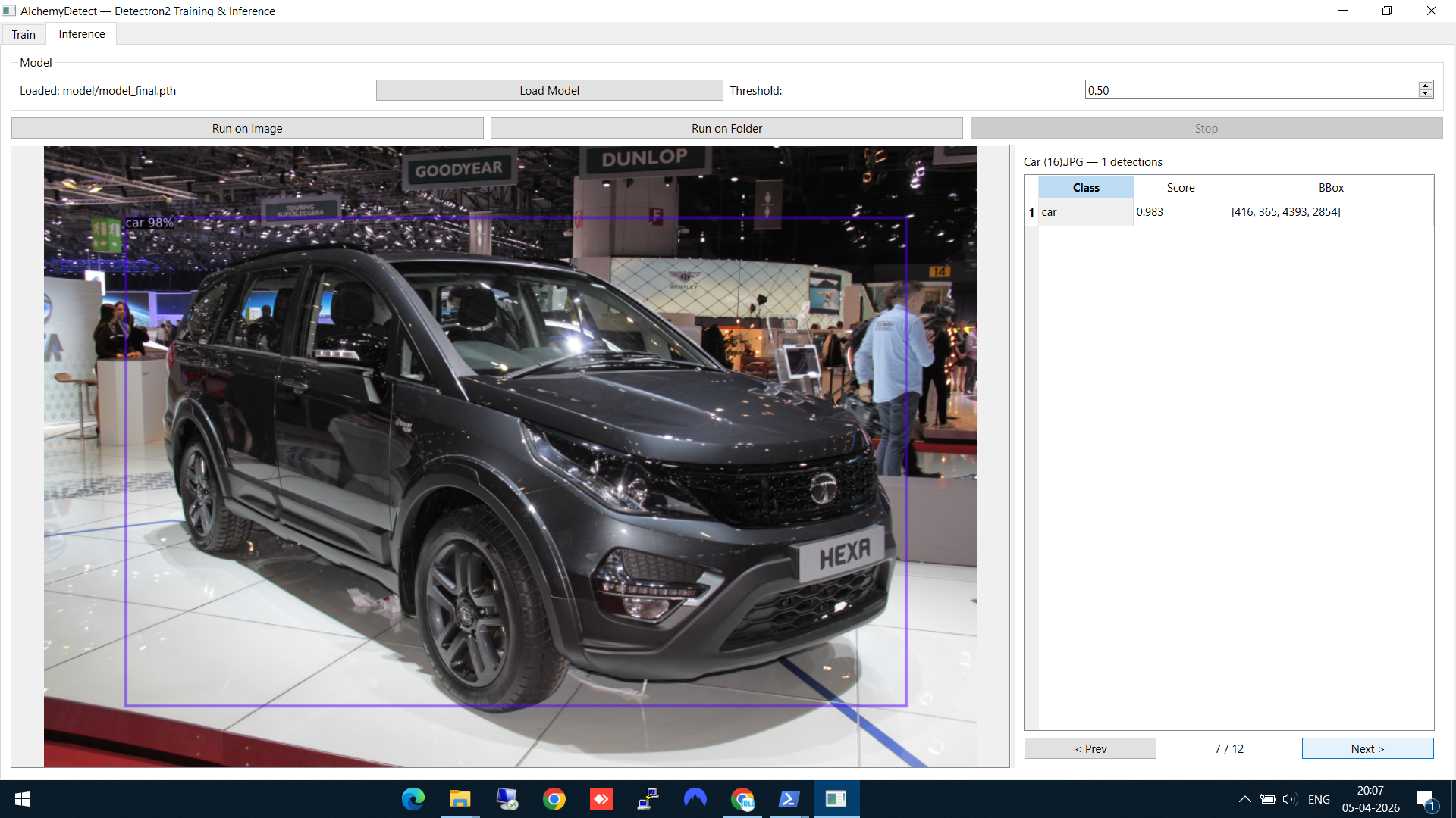 Car detected with confidence score and bounding box at an auto expo